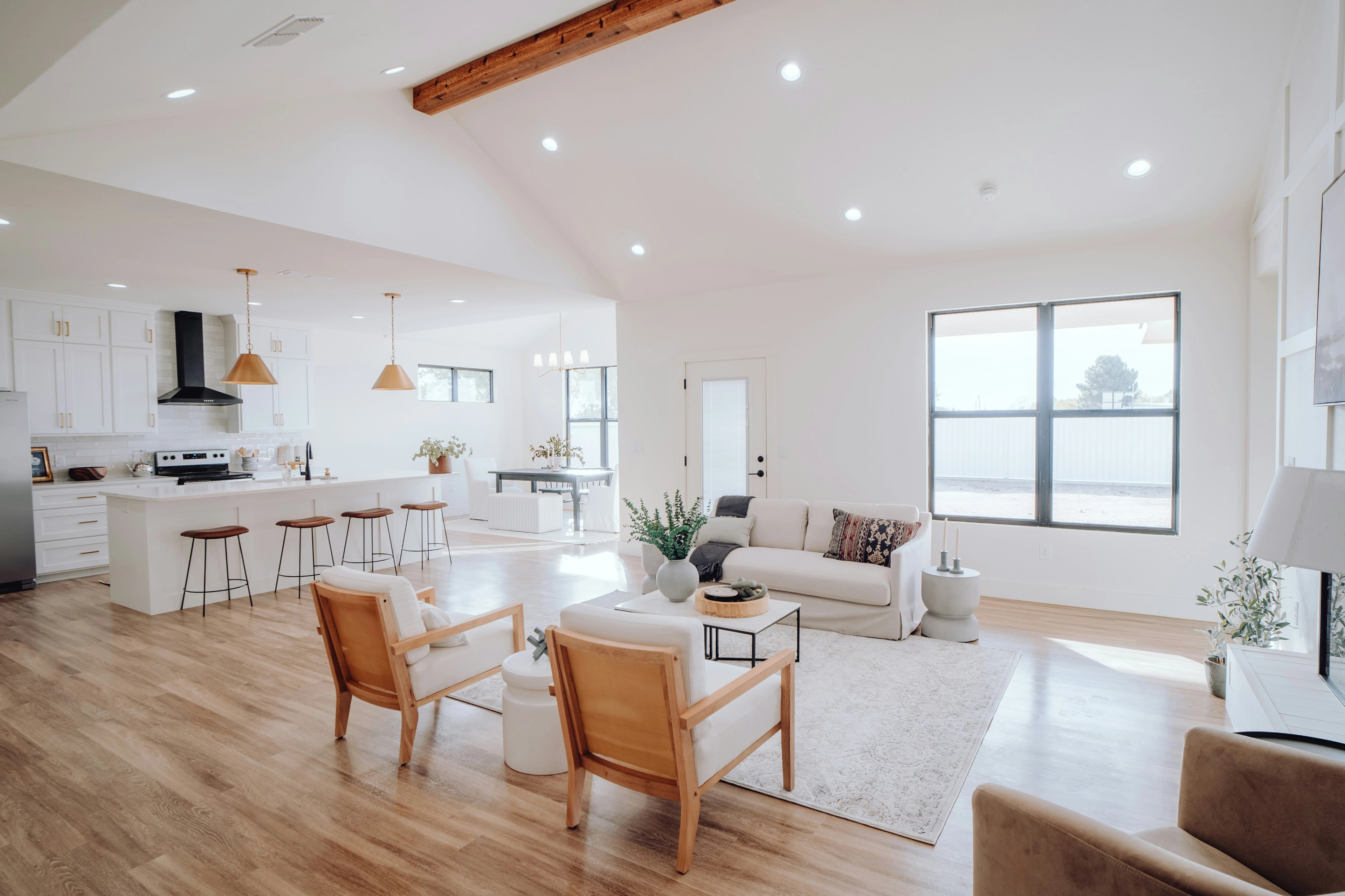 Bright open plan kitchen and living room finished by Amin & Brothers